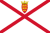 Flag with a red diagonal cross on a white field and a small crowned shield at the top center.